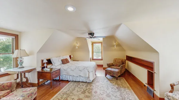 a living room with furniture and large window