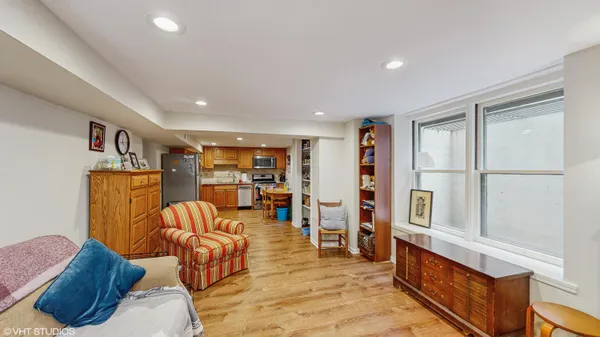 a bedroom with a bed and a book shelf