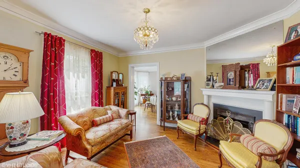 a living room with furniture fireplace and rug