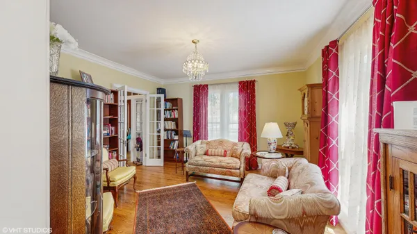 a living room with furniture a fireplace and a window