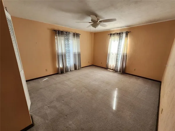 a view of an empty room with a window