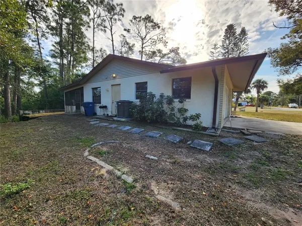 a house with trees in the background