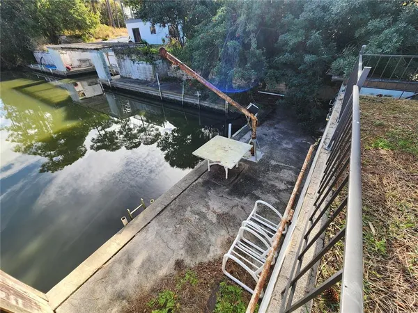 a view of a balcony with two chairs and a wooden floor