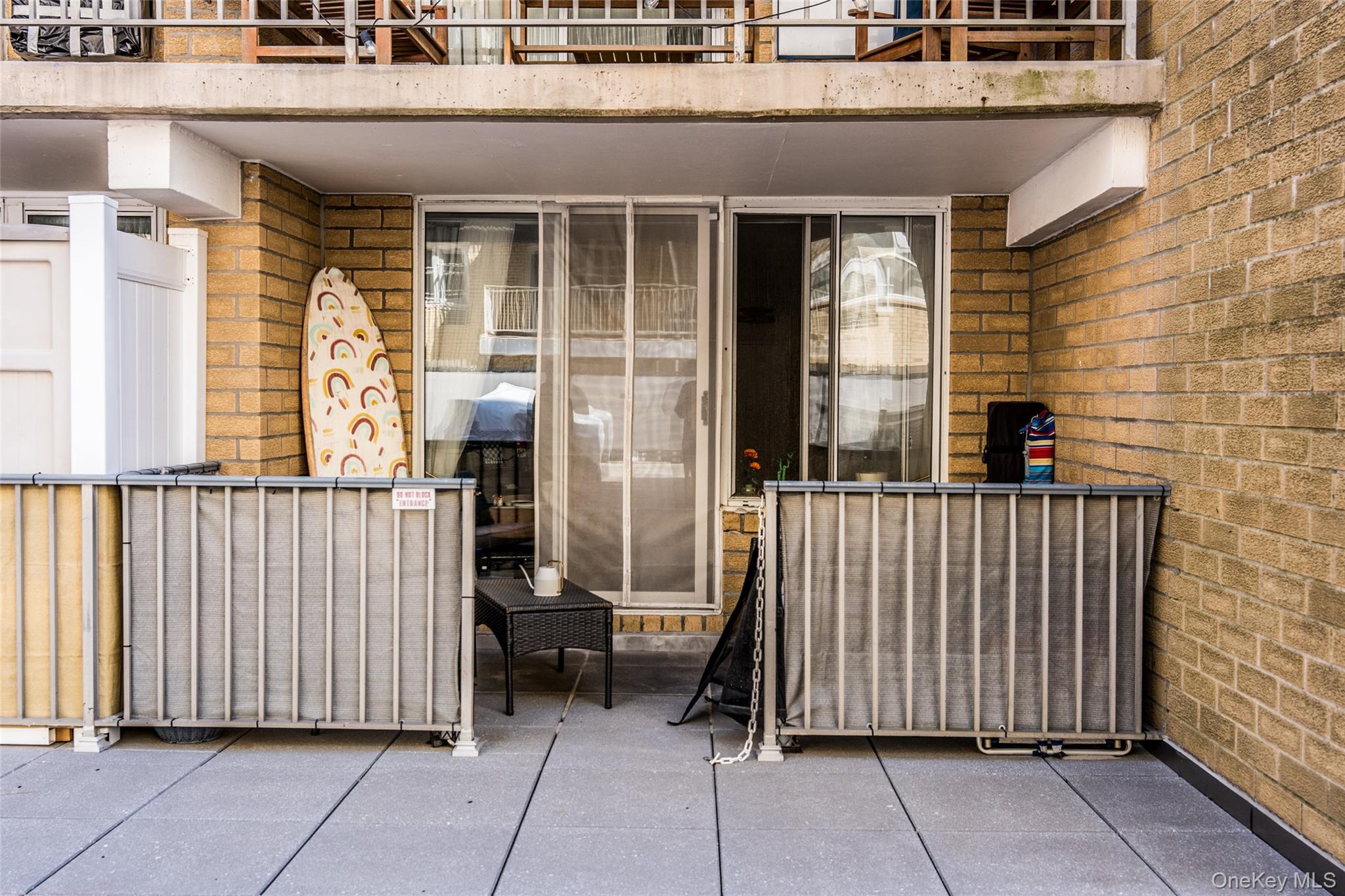 650 Shore Road, Unit 1C Long Beach, NY 11561 - Photo 2 of 21 a view of a house with wooden fence