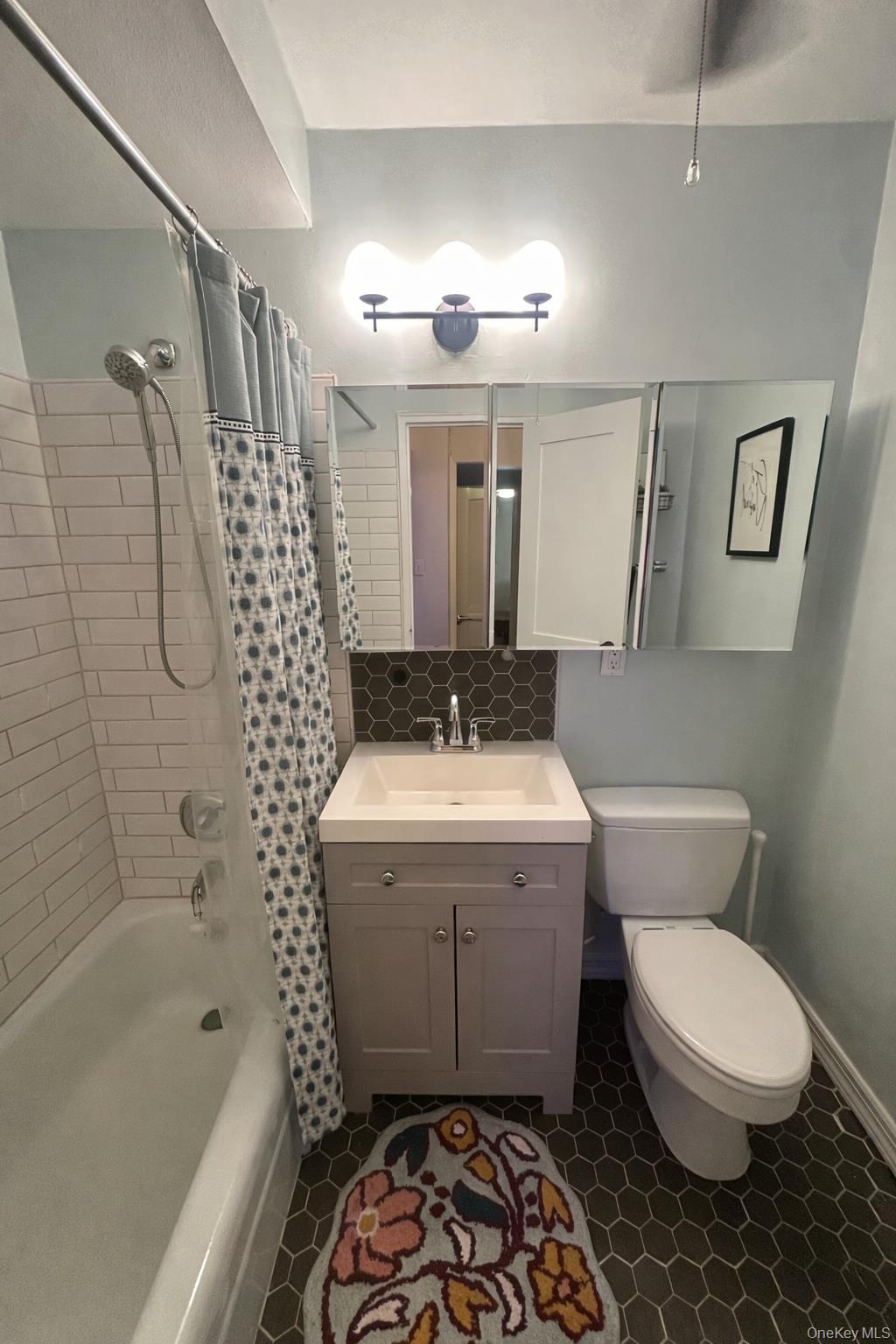 650 Shore Road, Unit 1C Long Beach, NY 11561 - Photo 10 of 21 a bathroom with a sink toilet and shower