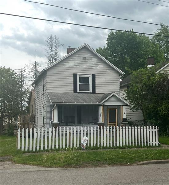 727 South State Line Road Sharon, PA 16146 - Photo 1 of 2 a front view of a house with a garden