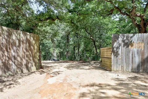 a view of a backyard of the house