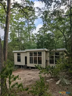 a house view with a backyard space