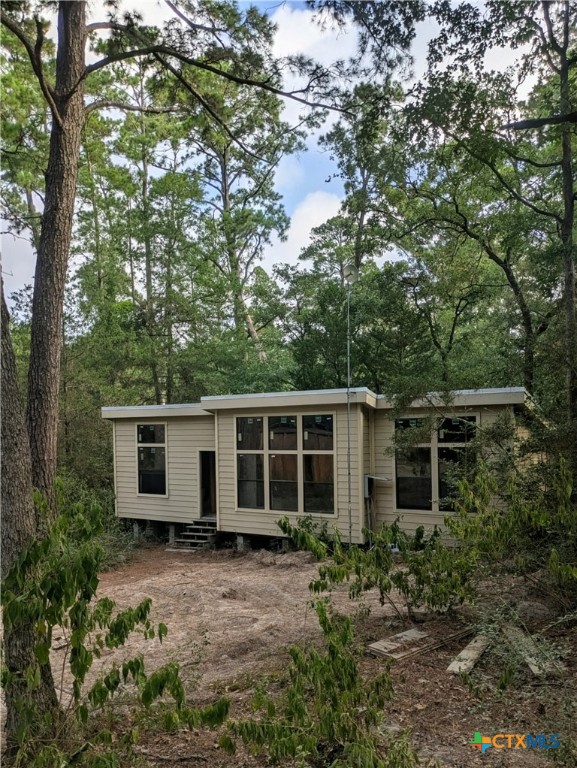 128 Barras Road Paige, TX 78659 - Photo 9 of 12 a house view with a backyard space