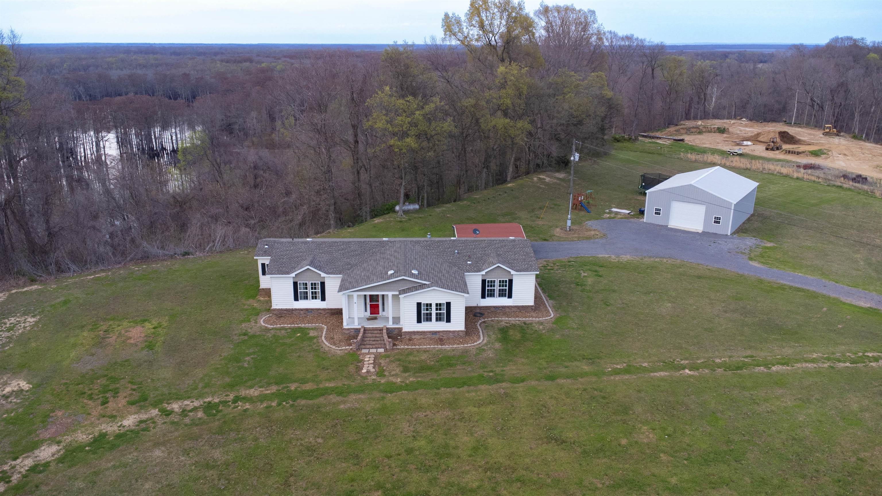 a aerial view of a house with a yard
