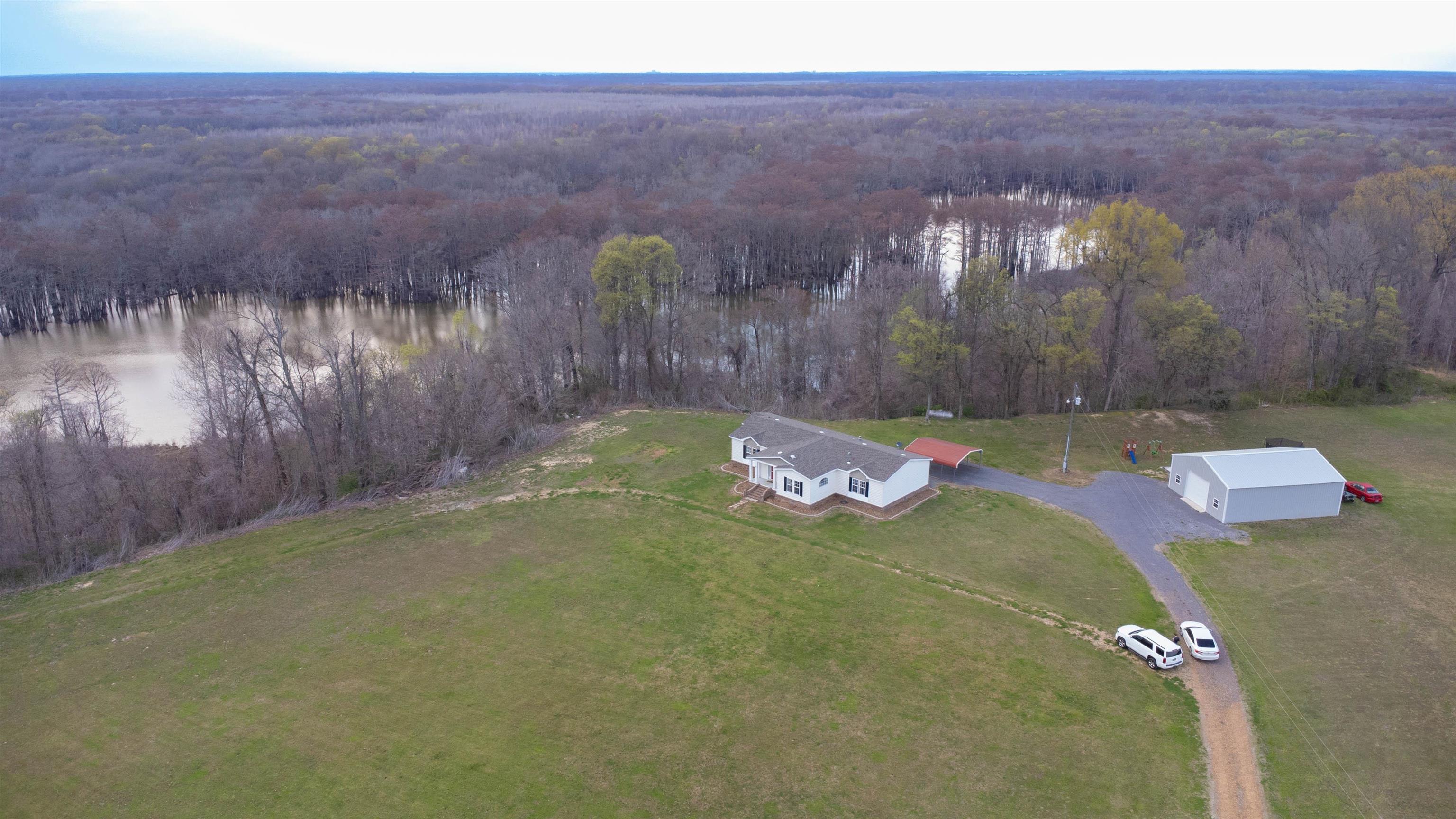 2914 Hobe Webb Road Ripley, TN 38063 - Photo 5 of 29 a view of a backyard of the house