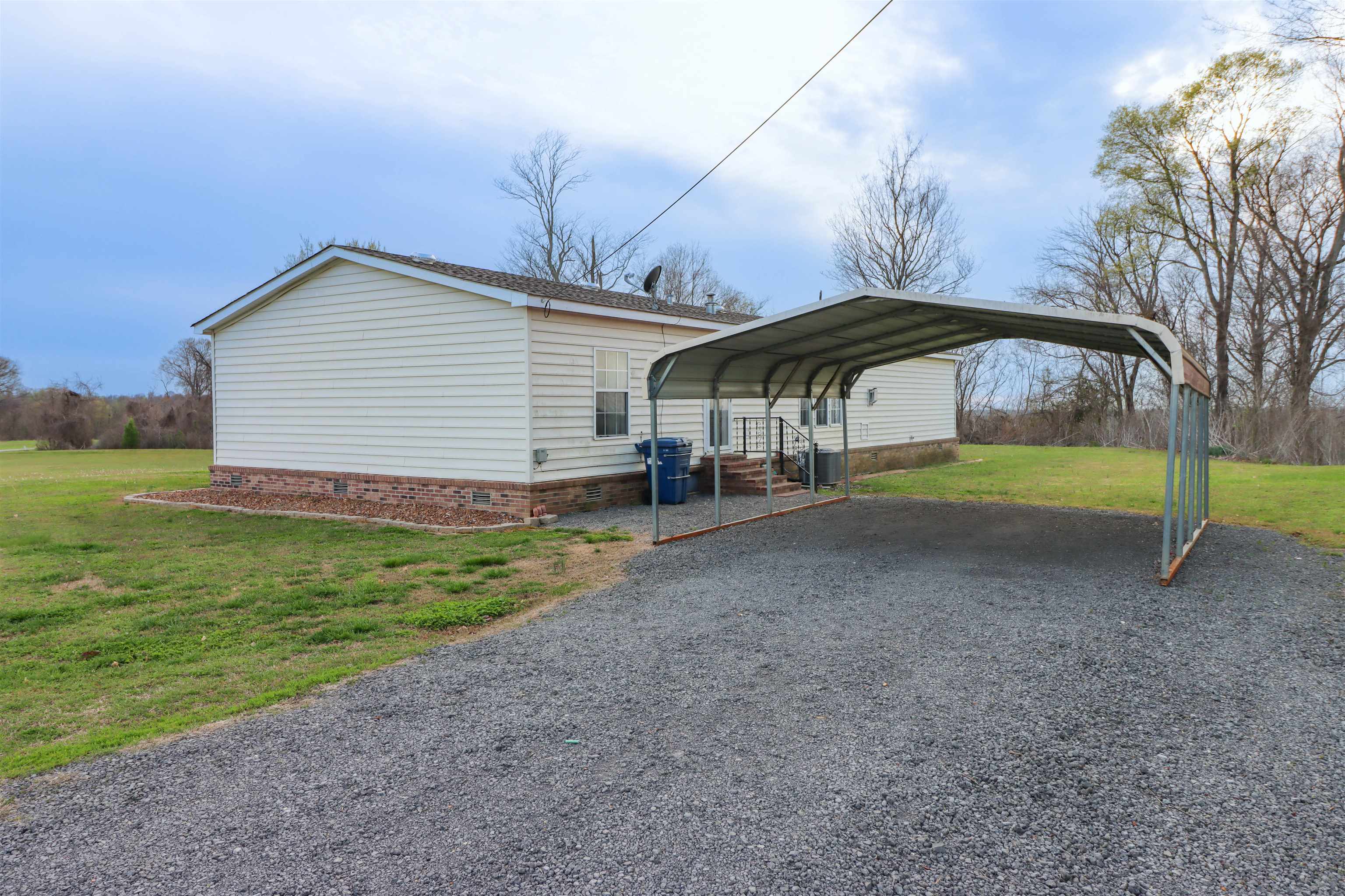 2914 Hobe Webb Road Ripley, TN 38063 - Photo 7 of 29 a view of a house with backyard and trees