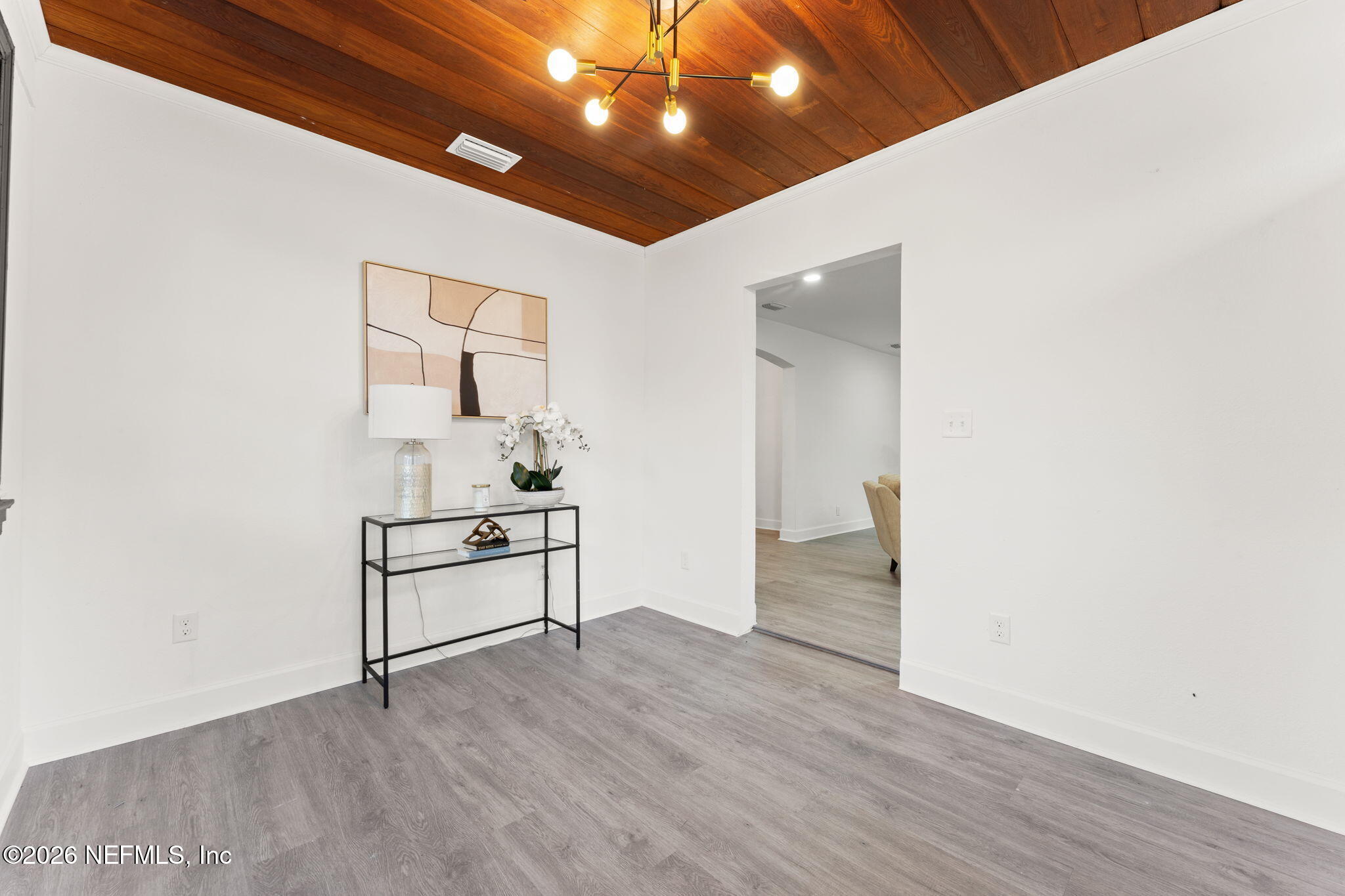 2131 Redfern Road Jacksonville, FL 32207 - Photo 2 of 13 a hallway with white cabinets and wooden floor