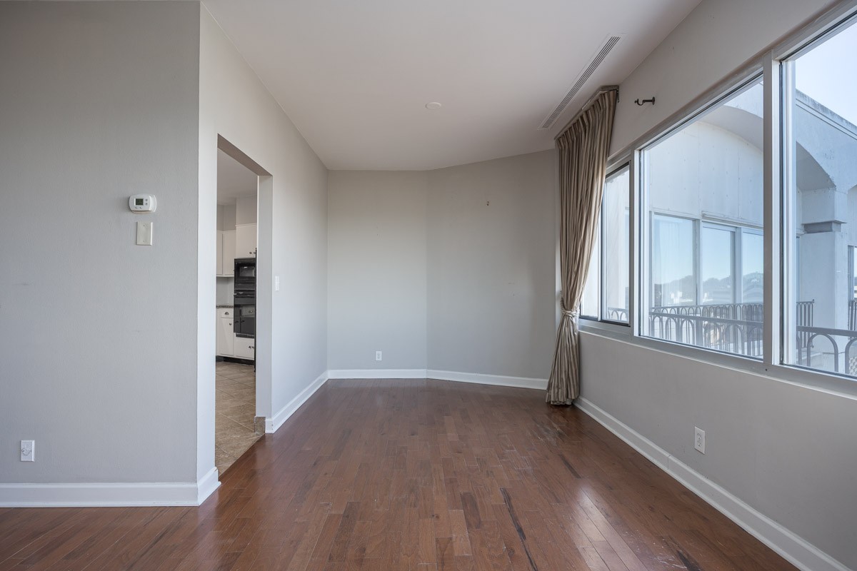 4215 Harding Pike, Unit 1203 Nashville, TN 37205 - Photo 15 of 43 wooden floor in an empty room with a window