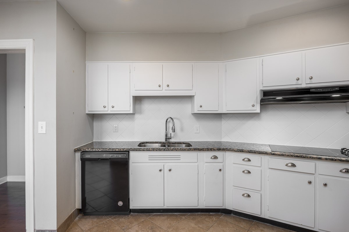 4215 Harding Pike, Unit 1203 Nashville, TN 37205 - Photo 19 of 43 a kitchen with granite countertop white cabinets and a stainless steel appliances