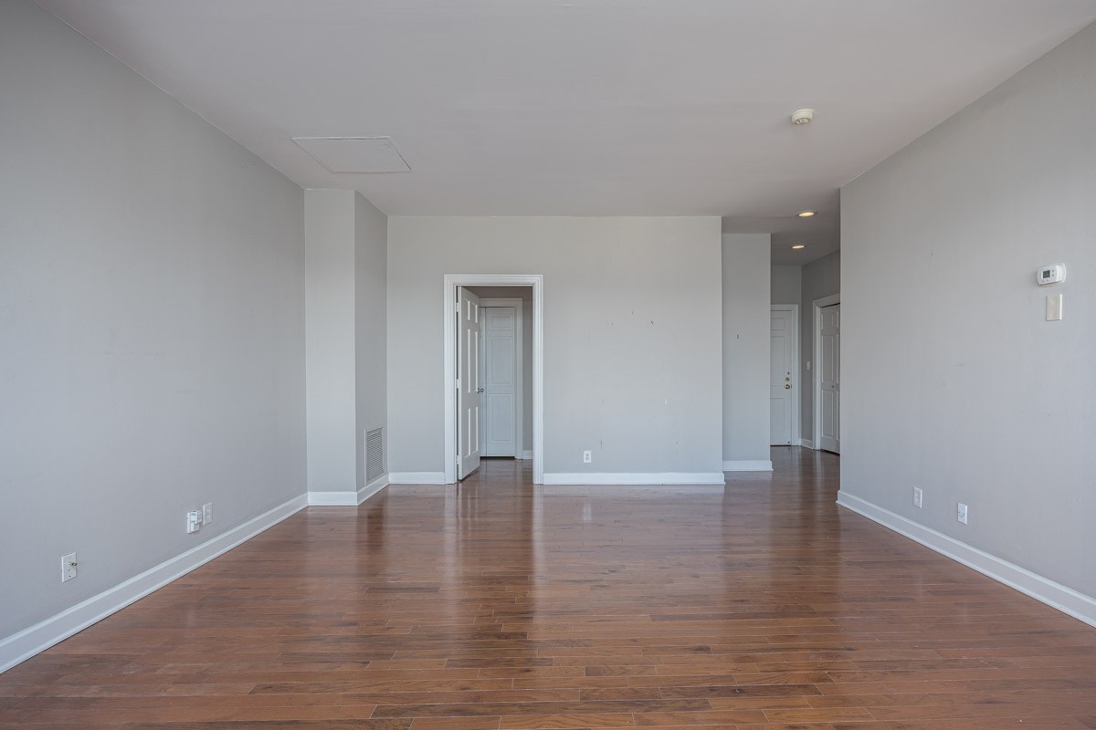 4215 Harding Pike, Unit 1203 Nashville, TN 37205 - Photo 23 of 43 a view of an empty room with wooden floor