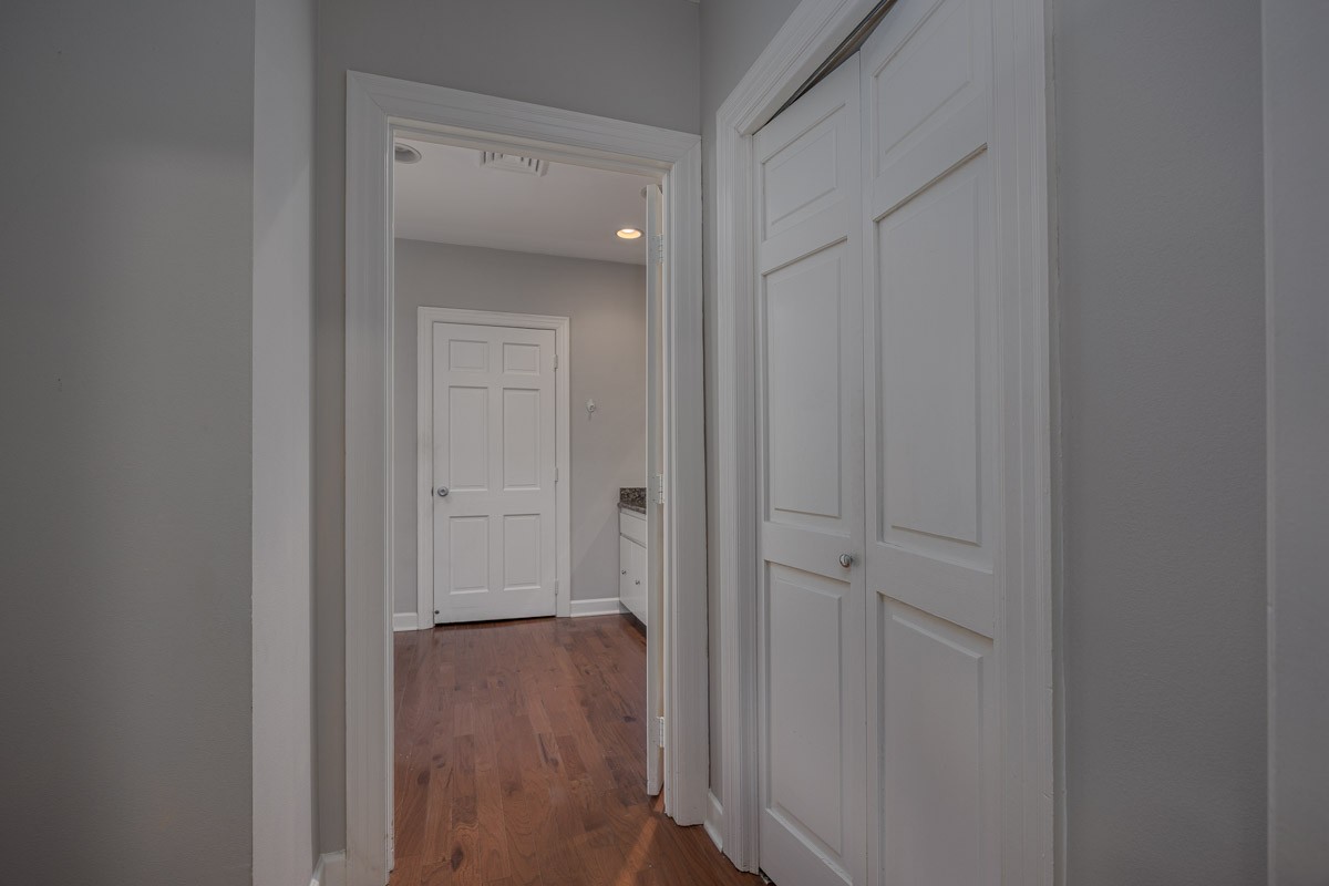 4215 Harding Pike, Unit 1203 Nashville, TN 37205 - Photo 26 of 43 a view of a hallway with wooden floor