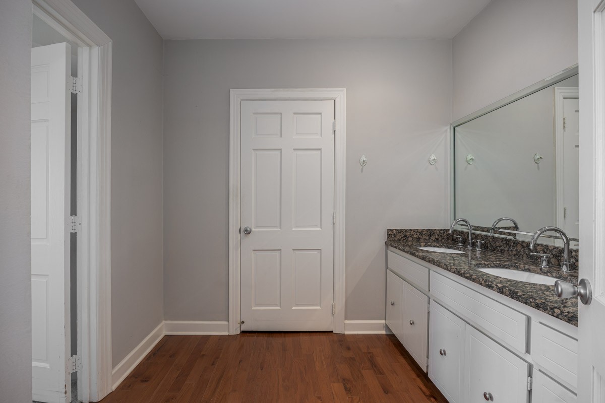 4215 Harding Pike, Unit 1203 Nashville, TN 37205 - Photo 27 of 43 a bathroom with a granite countertop sink and a mirror