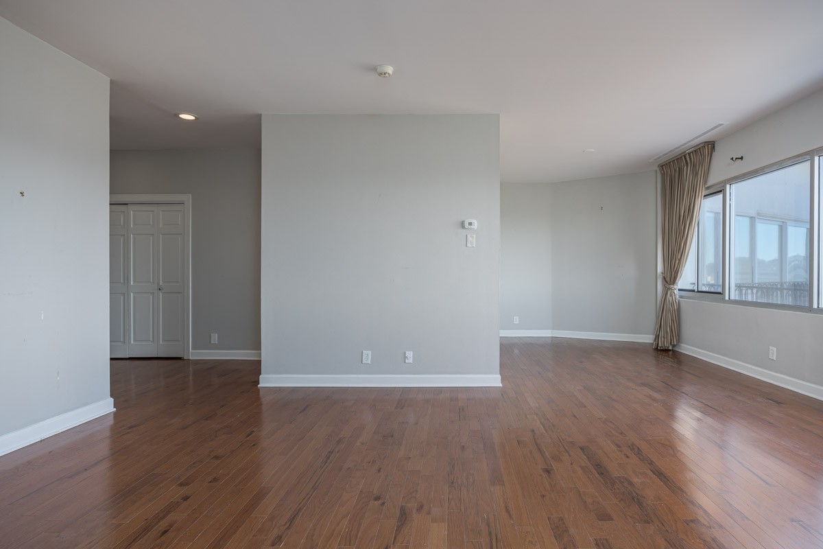 4215 Harding Pike, Unit 1203 Nashville, TN 37205 - Photo 37 of 43 an empty room with wooden floor and windows
