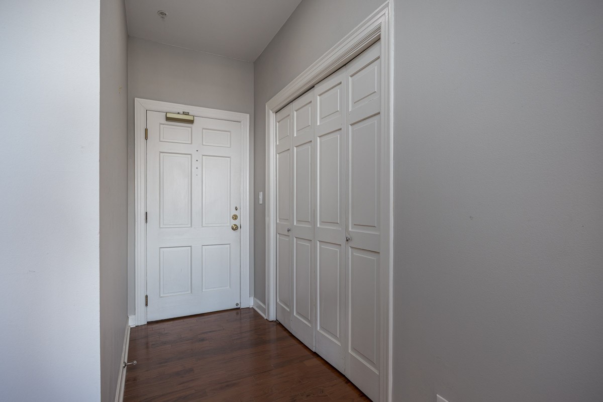 4215 Harding Pike, Unit 1203 Nashville, TN 37205 - Photo 38 of 43 a view of a hallway with wooden floor