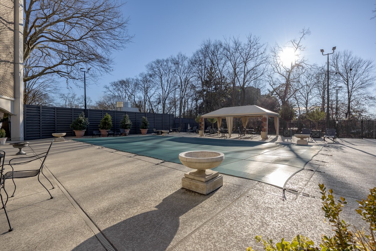 4215 Harding Pike, Unit 1203 Nashville, TN 37205 - Photo 42 of 43 a swimming pool with outdoor seating yard and trees
