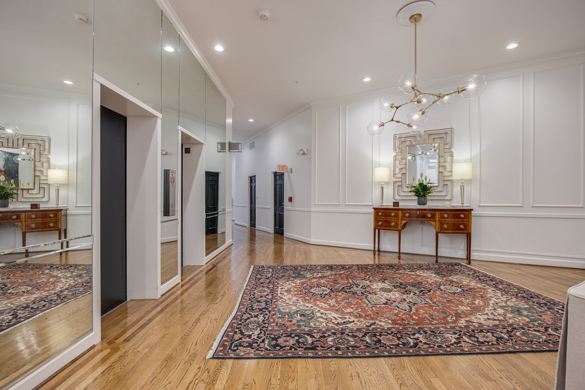 4215 Harding Pike, Unit 1203 Nashville, TN 37205 - Photo 7 of 43 a large hall with stainless steel appliances granite countertop furniture and a rug