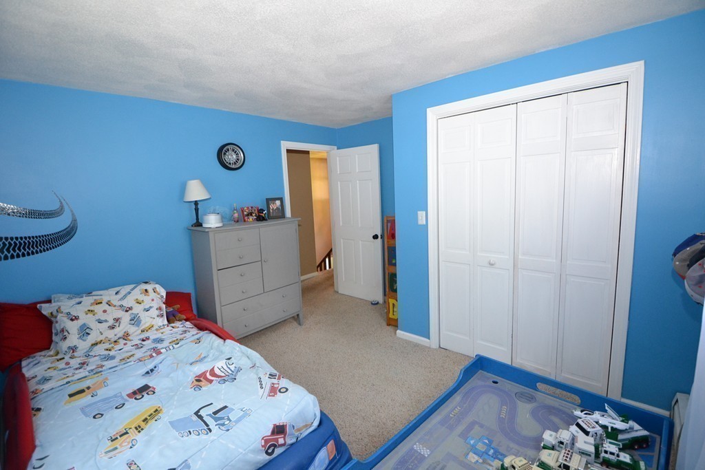 395 Mendon Road North Attleboro, MA 02760 - Photo 13 of 14 a bedroom with a bed and a dresser