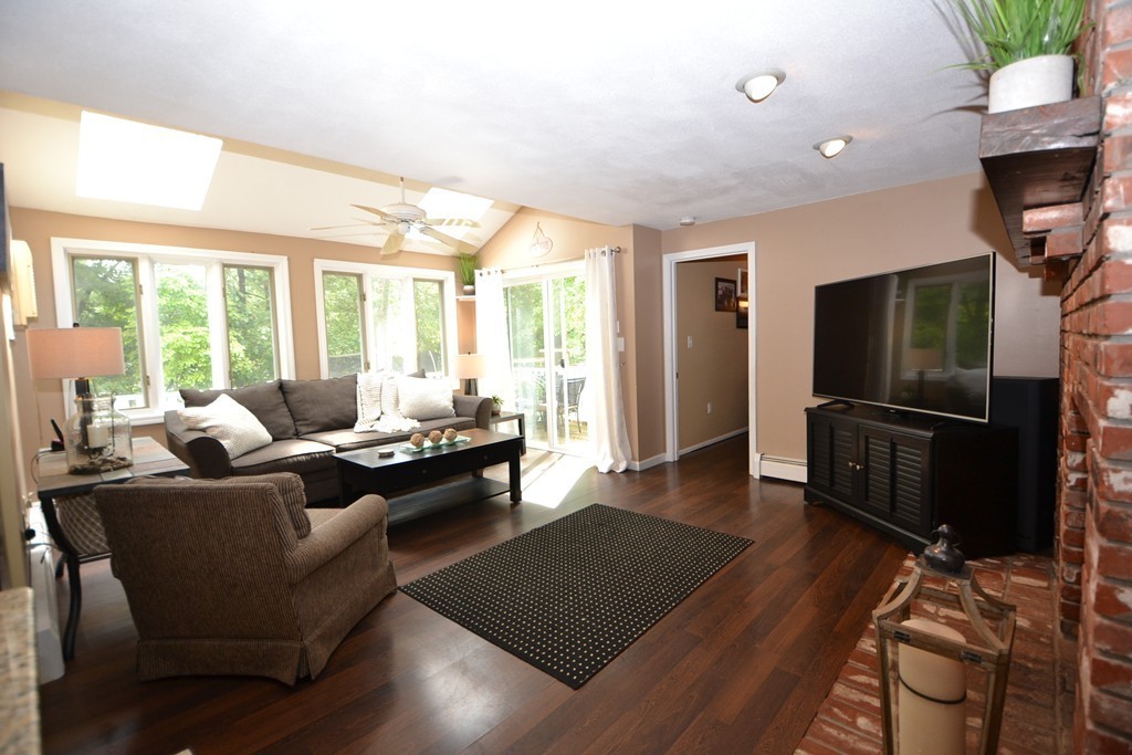 395 Mendon Road North Attleboro, MA 02760 - Photo 3 of 14 a living room with furniture and a flat screen tv