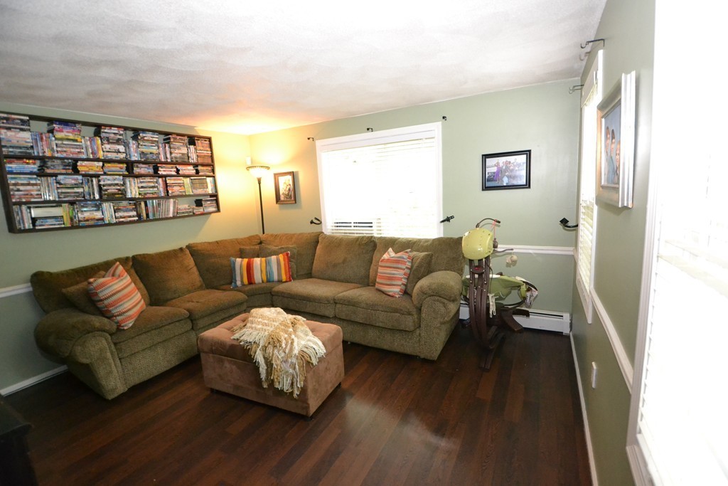 395 Mendon Road North Attleboro, MA 02760 - Photo 5 of 14 a living room with furniture and a wooden floor