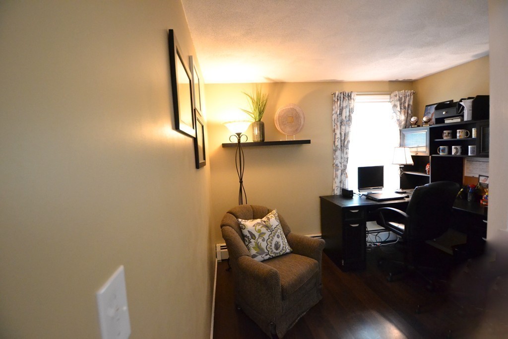 395 Mendon Road North Attleboro, MA 02760 - Photo 7 of 14 a living room with furniture and a flat screen tv