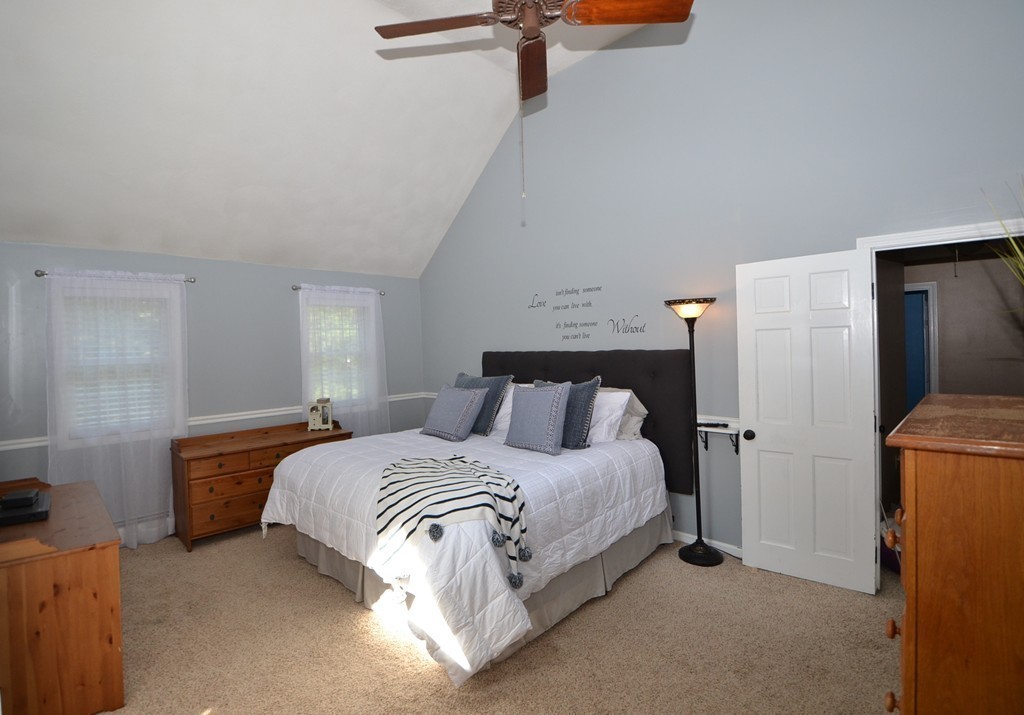 395 Mendon Road North Attleboro, MA 02760 - Photo 8 of 14 a bedroom with a bed and a cabinets