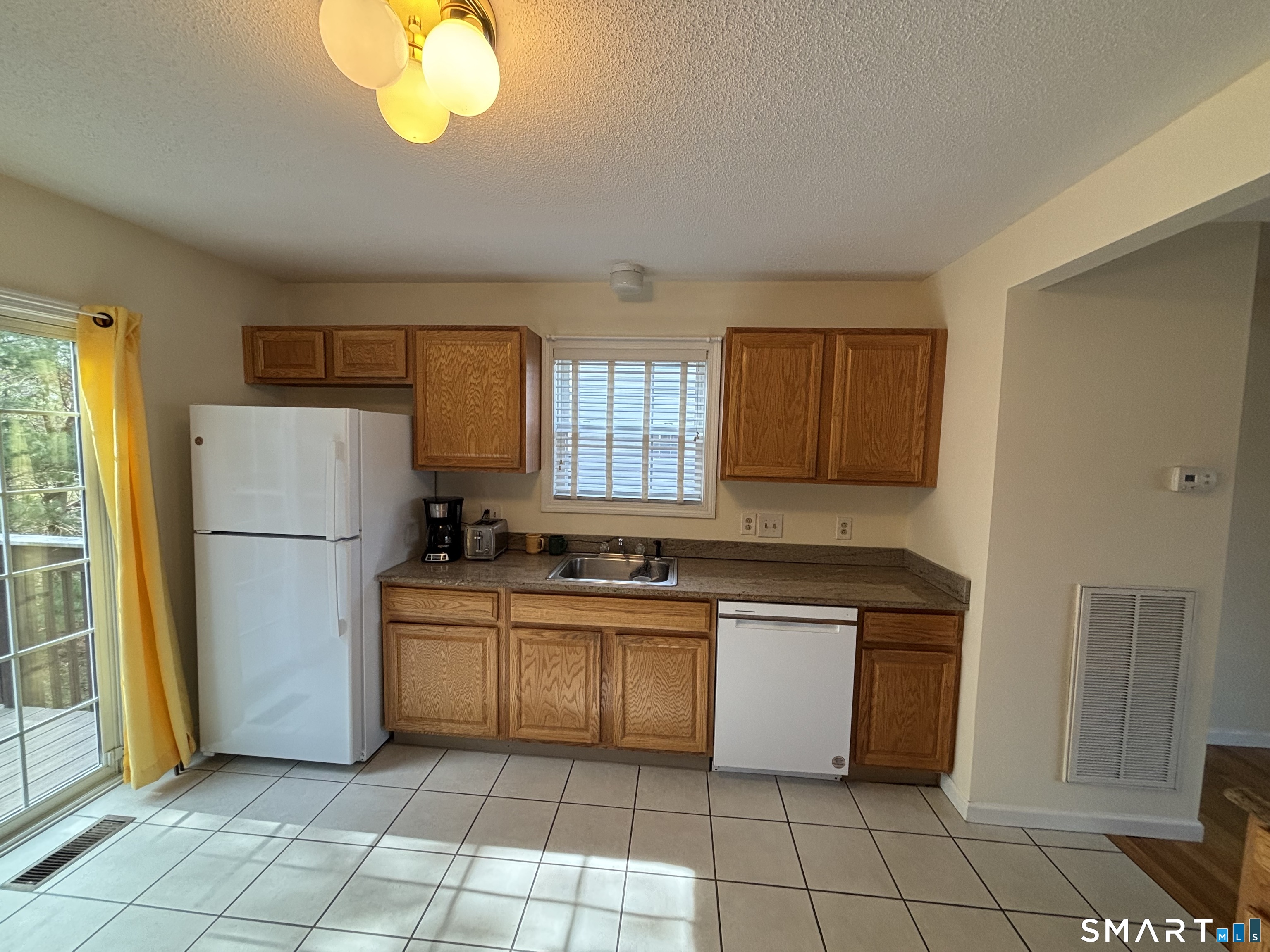 83 Danny's Way, Unit 83 Wallingford, CT 06492 - Photo 11 of 38 a kitchen with a cabinets a sink and stainless steel appliances