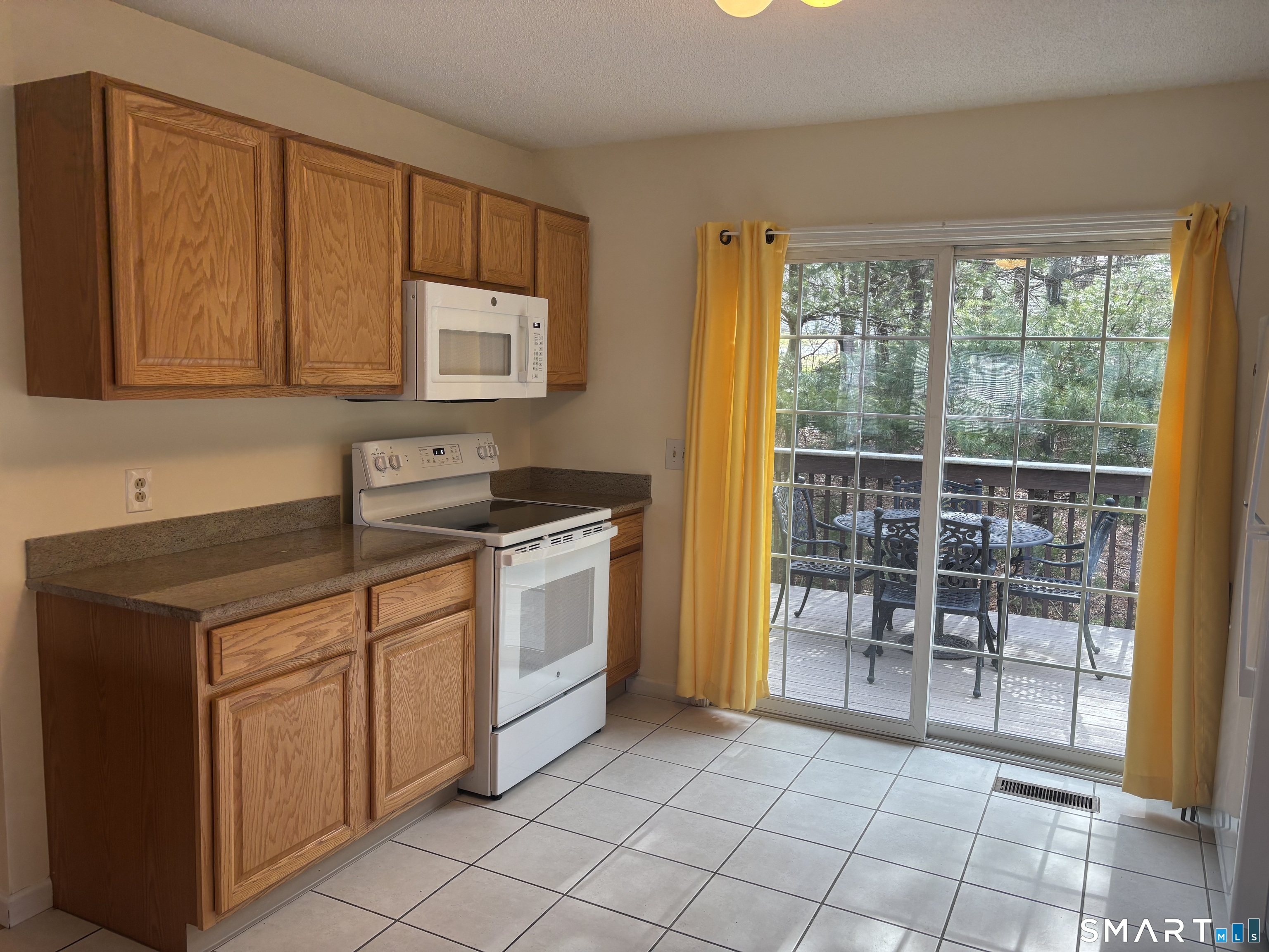 83 Danny's Way, Unit 83 Wallingford, CT 06492 - Photo 13 of 38 a kitchen with a sink and a stove top oven