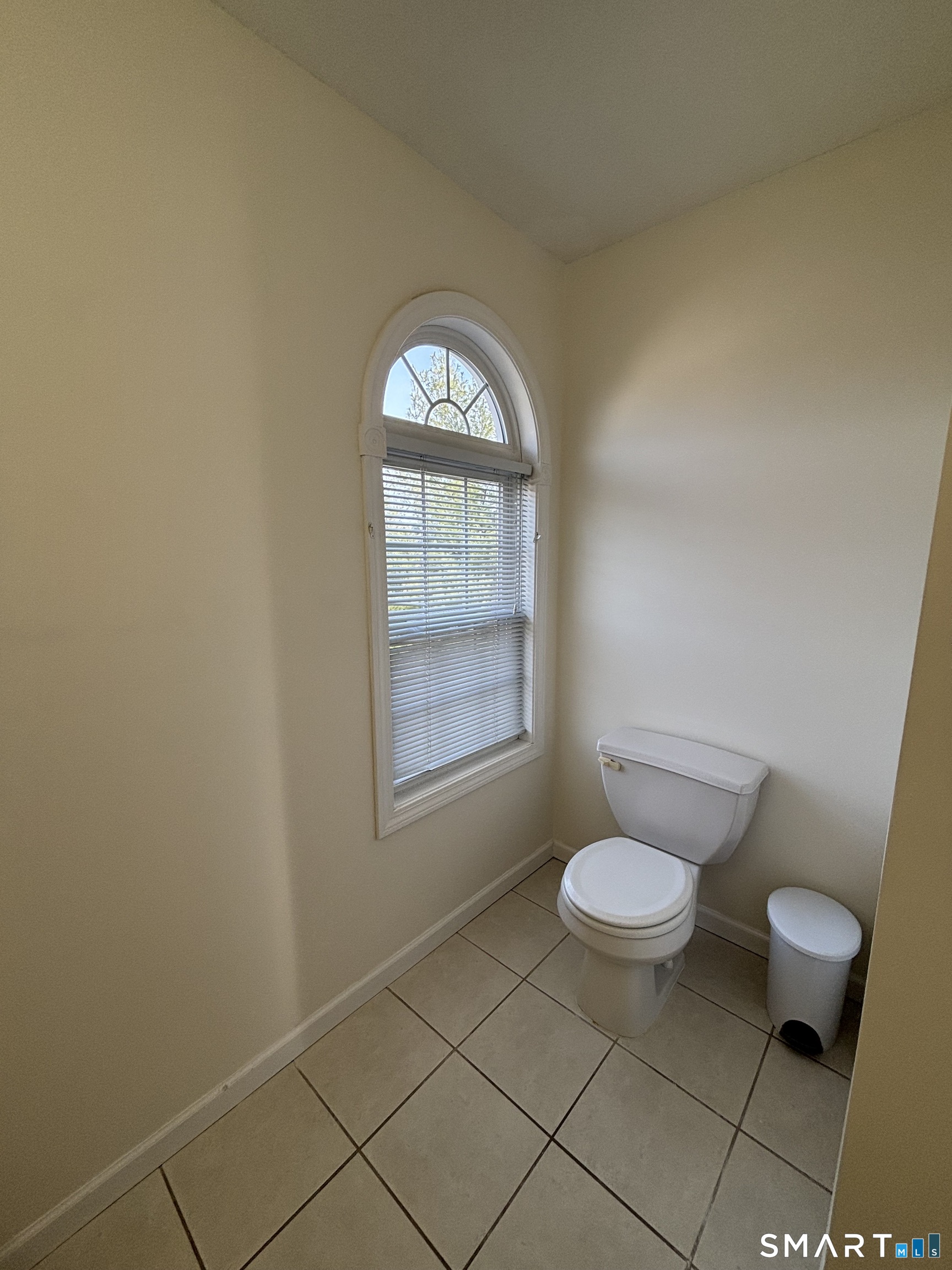 83 Danny's Way, Unit 83 Wallingford, CT 06492 - Photo 15 of 38 a bathroom with a granite countertop toilet and a sink