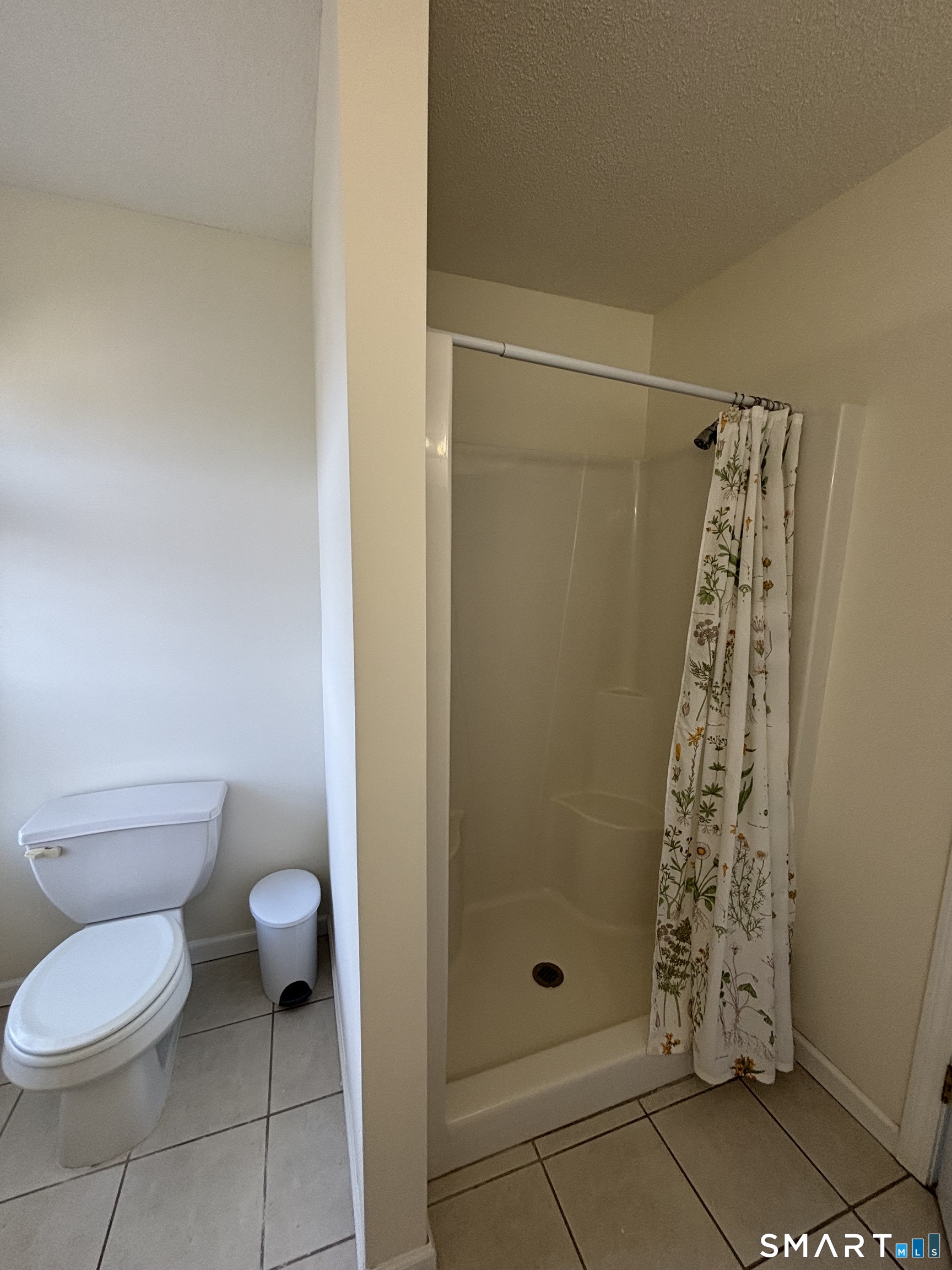 83 Danny's Way, Unit 83 Wallingford, CT 06492 - Photo 16 of 38 a bathroom with a toilet and shower