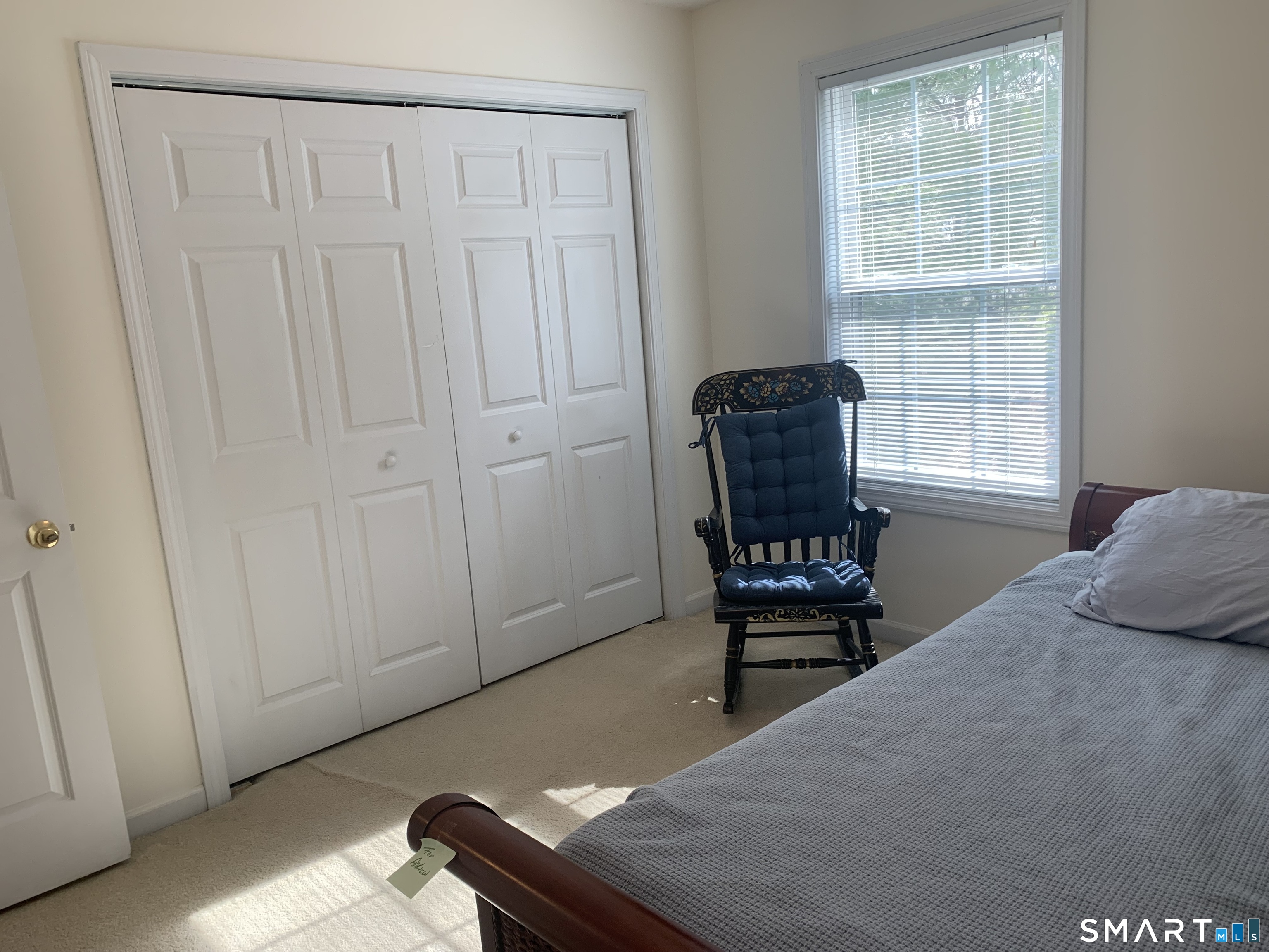83 Danny's Way, Unit 83 Wallingford, CT 06492 - Photo 22 of 38 a bedroom with a bed and a window
