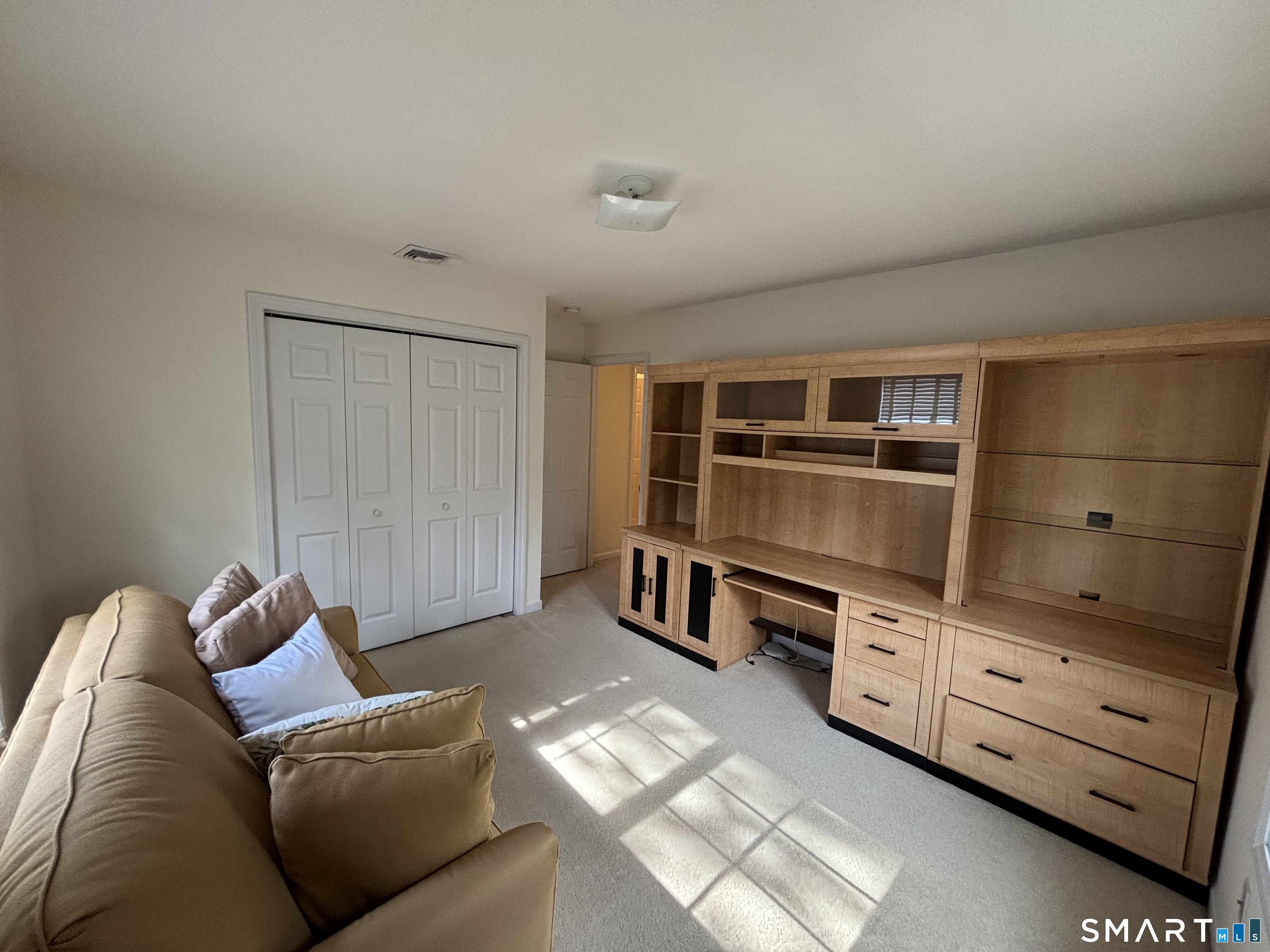 83 Danny's Way, Unit 83 Wallingford, CT 06492 - Photo 28 of 38 a living room with furniture