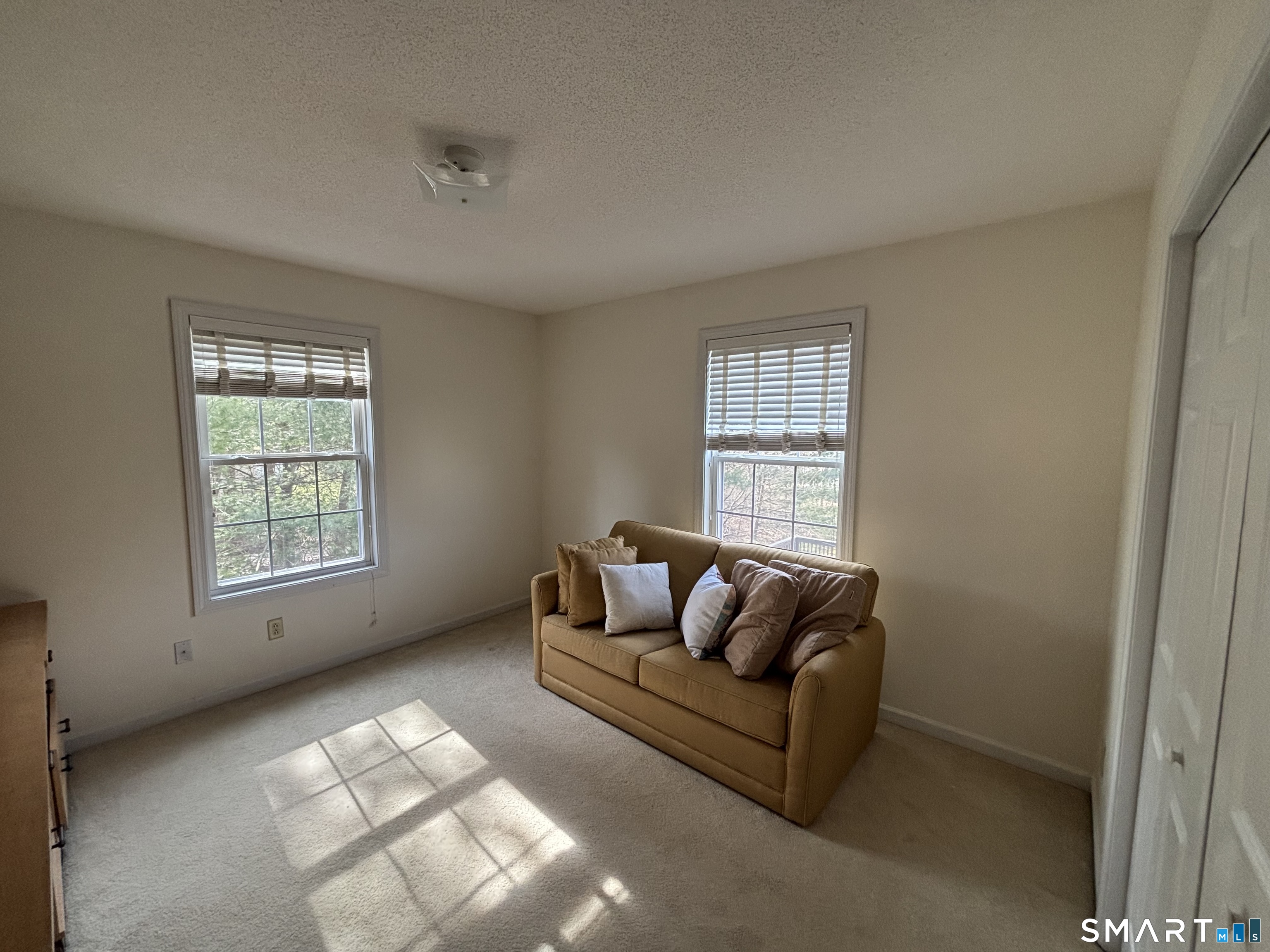 83 Danny's Way, Unit 83 Wallingford, CT 06492 - Photo 29 of 38 a living room with furniture and a window
