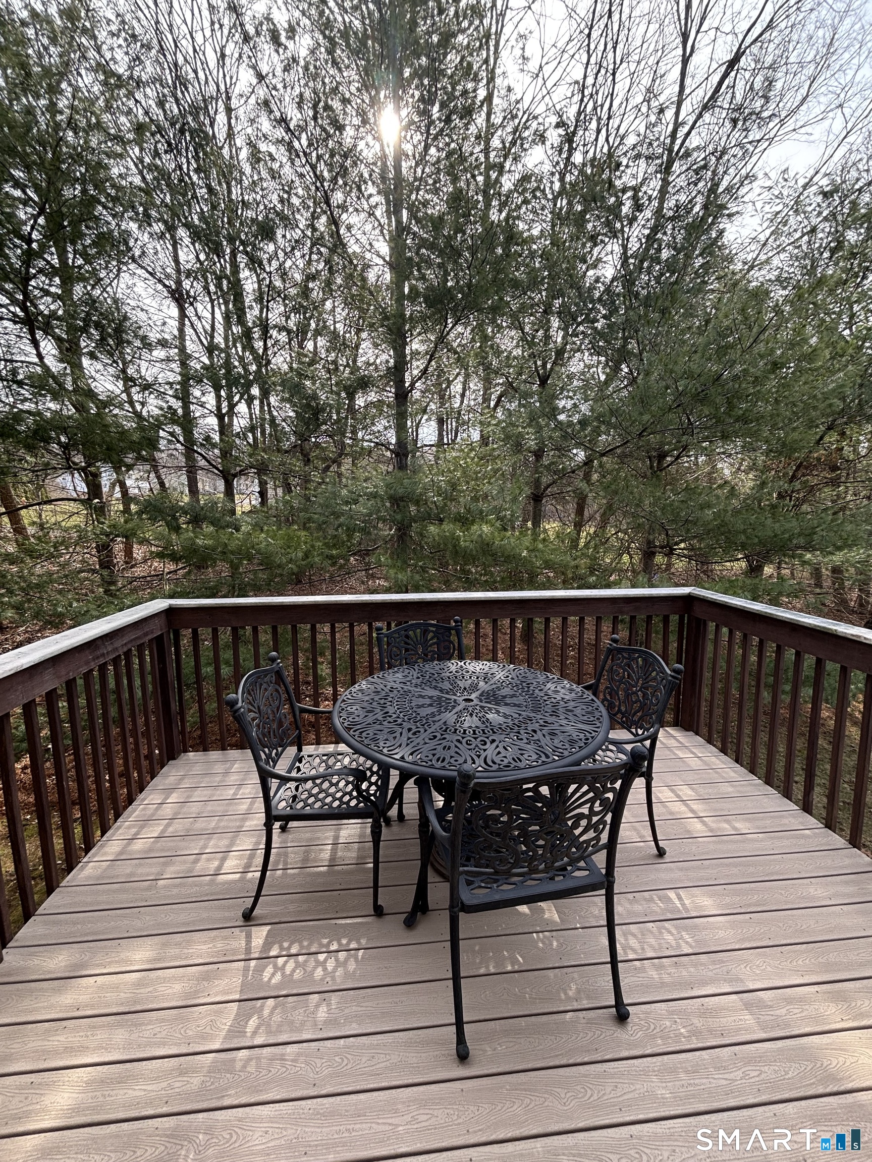 83 Danny's Way, Unit 83 Wallingford, CT 06492 - Photo 33 of 38 a view of a wooden deck and outdoor seating