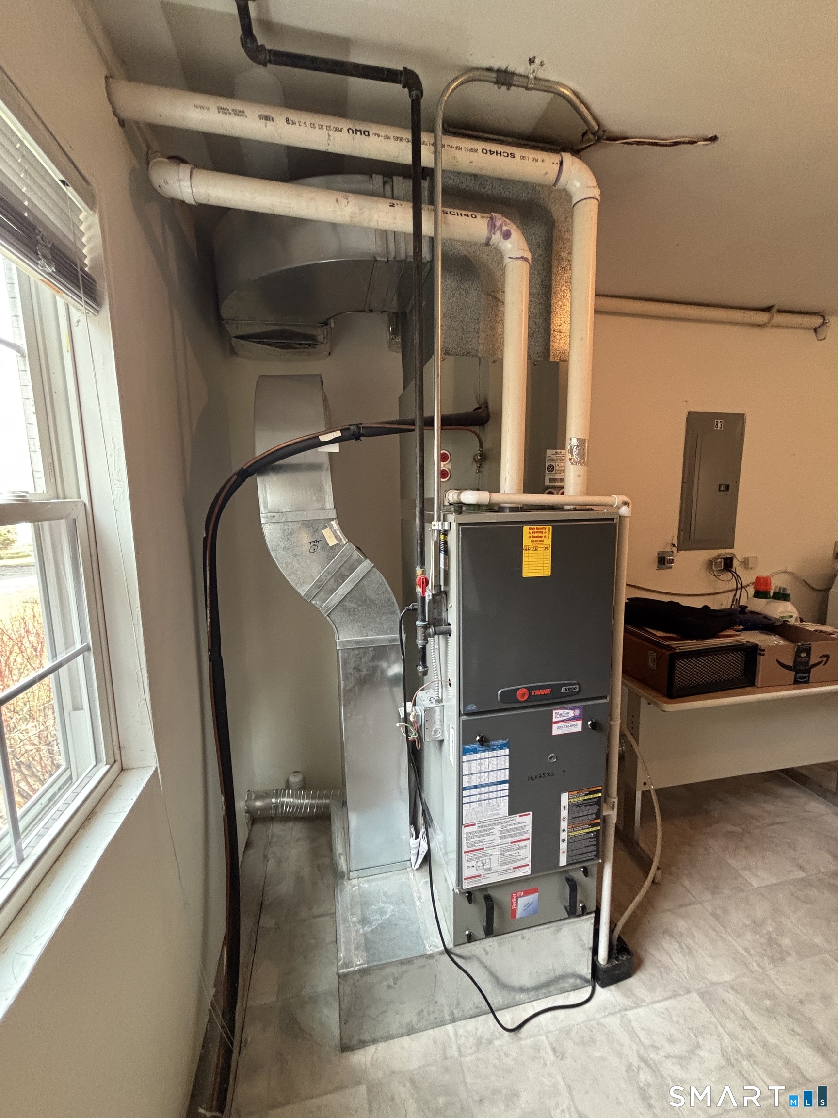 83 Danny's Way, Unit 83 Wallingford, CT 06492 - Photo 38 of 38 a view of workspace with wooden floor and windows