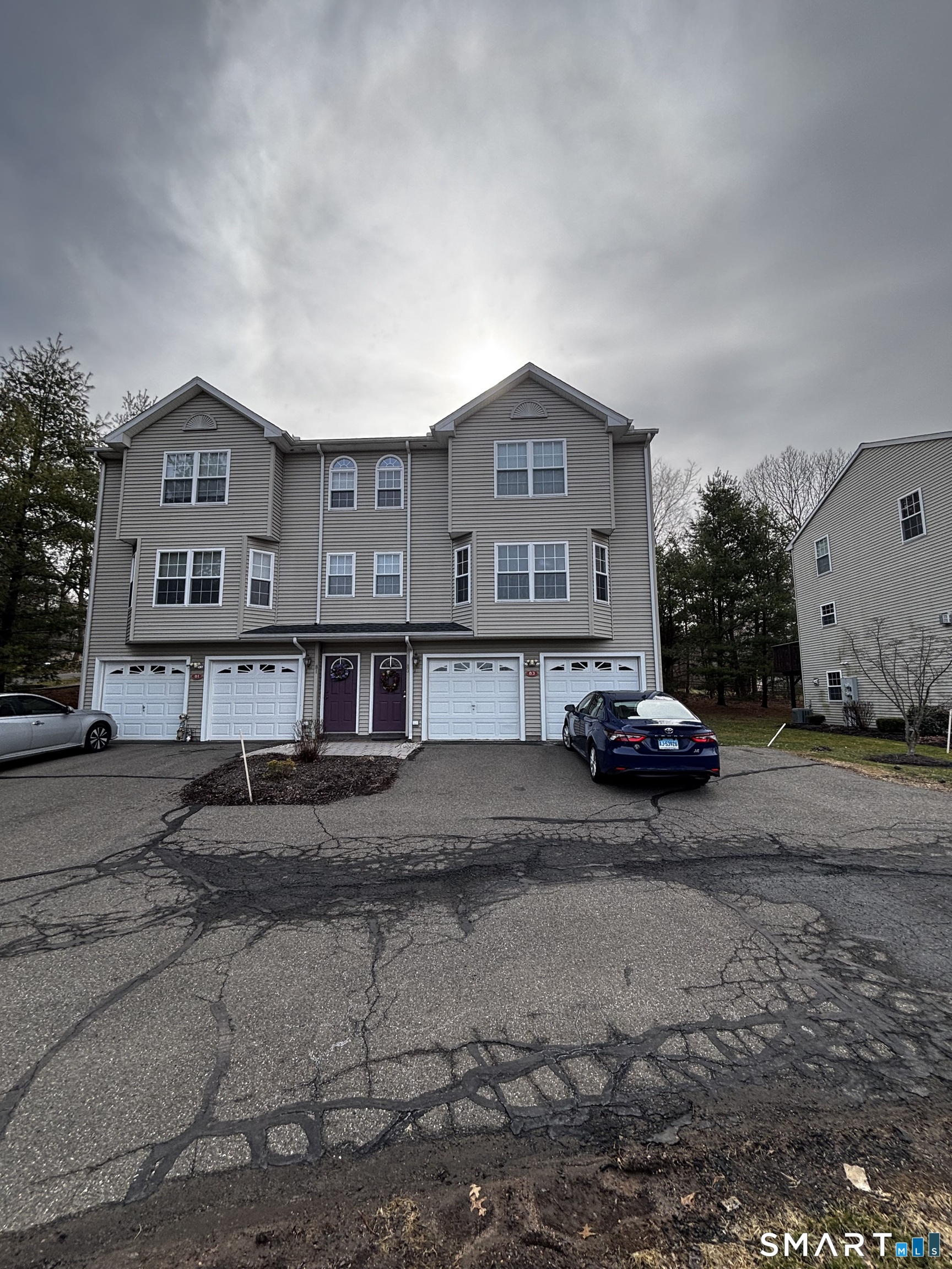 83 Danny's Way, Unit 83 Wallingford, CT 06492 - Photo 4 of 38 a view of a car park in front of house