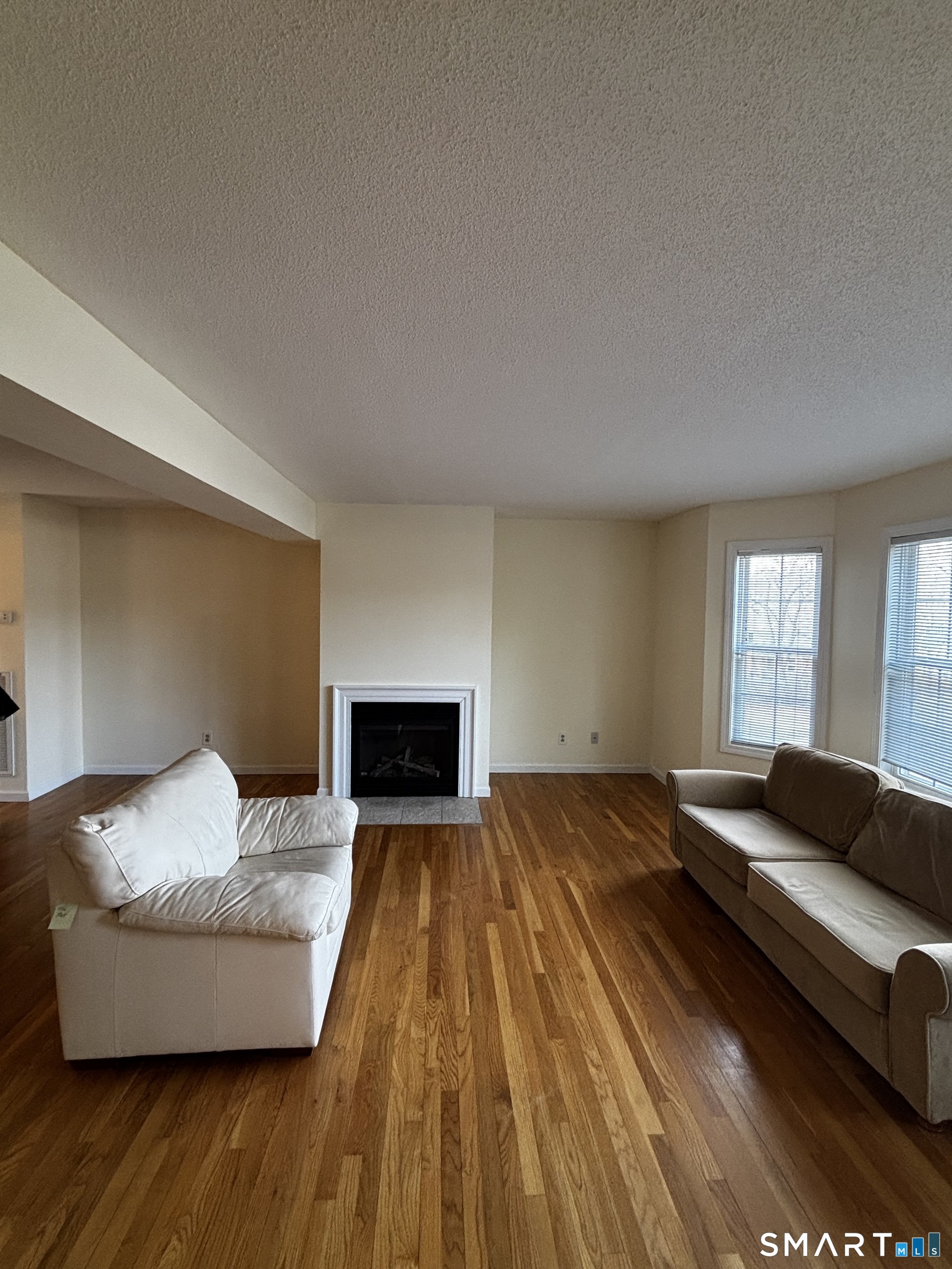 83 Danny's Way, Unit 83 Wallingford, CT 06492 - Photo 9 of 38 a living room with furniture and a couch
