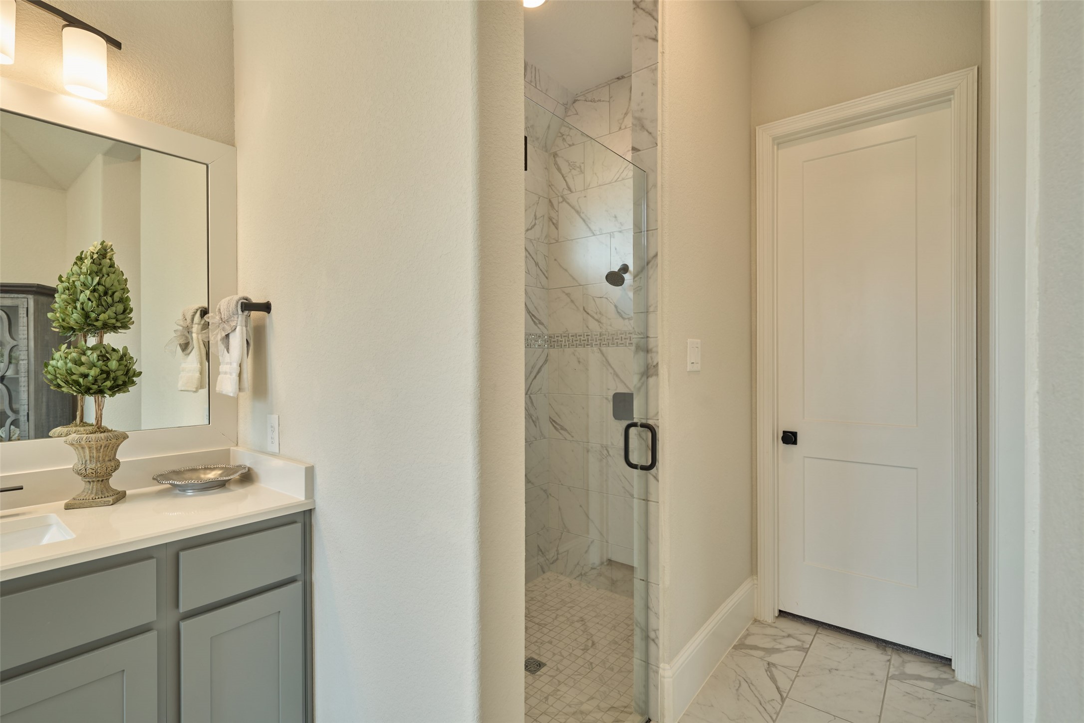 10090 South Goshawk Trail Conroe, TX 77385 - Photo 21 of 43 Designer finishes with tile floor to ceiling in this beautiful shower.