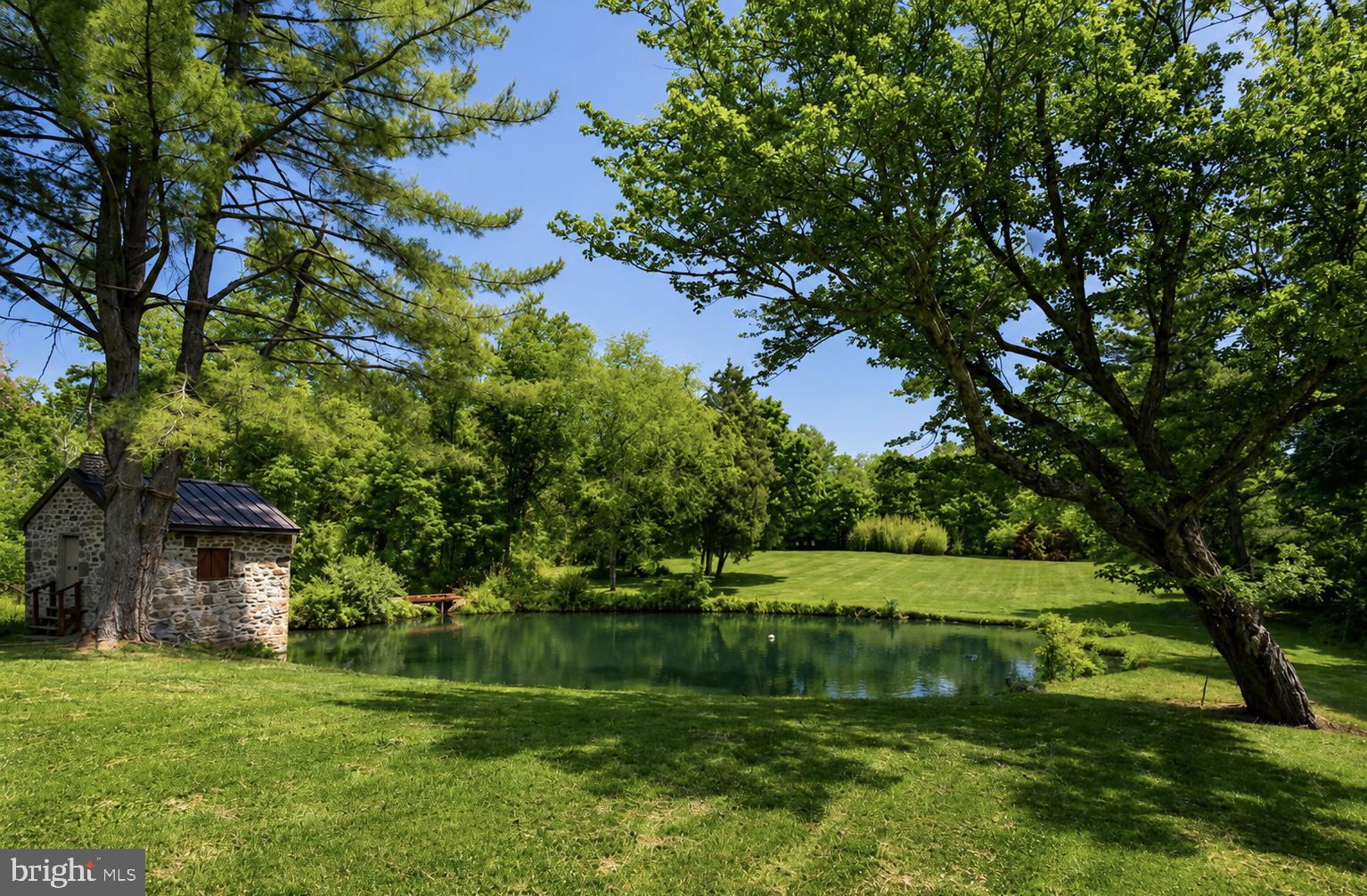 108 Sheeder Road Phoenixville, PA 19460 - Photo 31 of 42 a view of a golf course with a lake