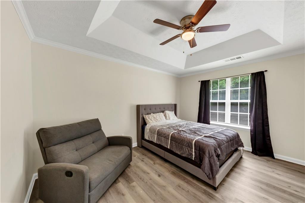2880 Field Spring Drive Lithonia, GA 30058 - Photo 23 of 31 a bedroom with a bed couch and window