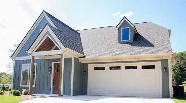 a view of house with yard