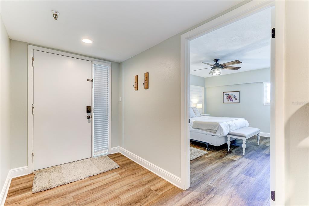 16332 Gulf Boulevard, Unit 1C Redington Beach, FL 33708 - Photo 14 of 90 a view of a bedroom window and wooden floor