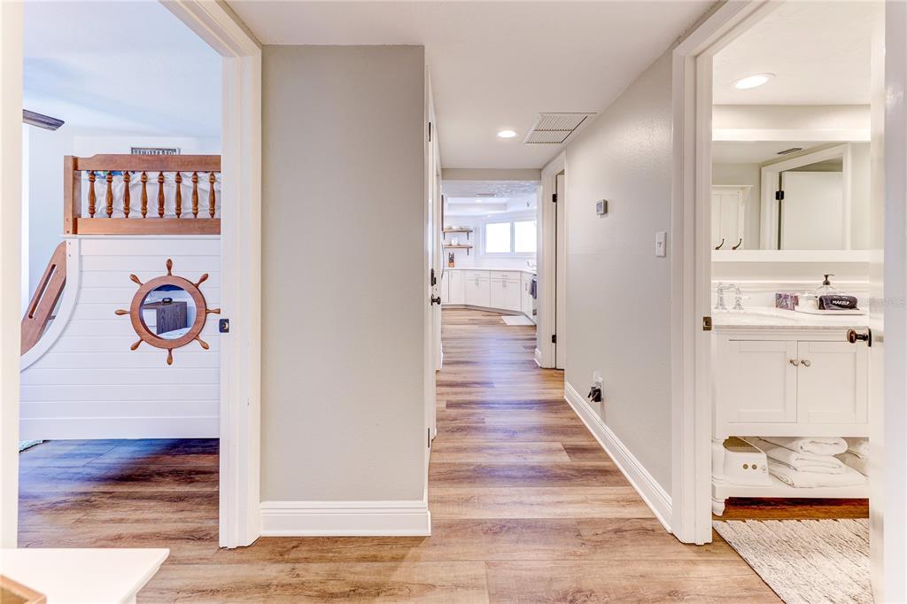 16332 Gulf Boulevard, Unit 1C Redington Beach, FL 33708 - Photo 22 of 90 a view of a hallway with wooden floor and dining room