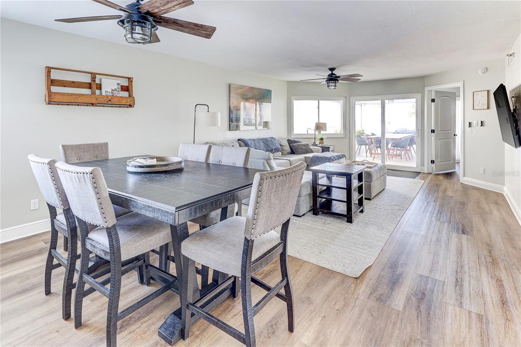 16332 Gulf Boulevard, Unit 1C Redington Beach, FL 33708 - Photo 48 of 90 a view of a dining room with furniture window and wooden floor
