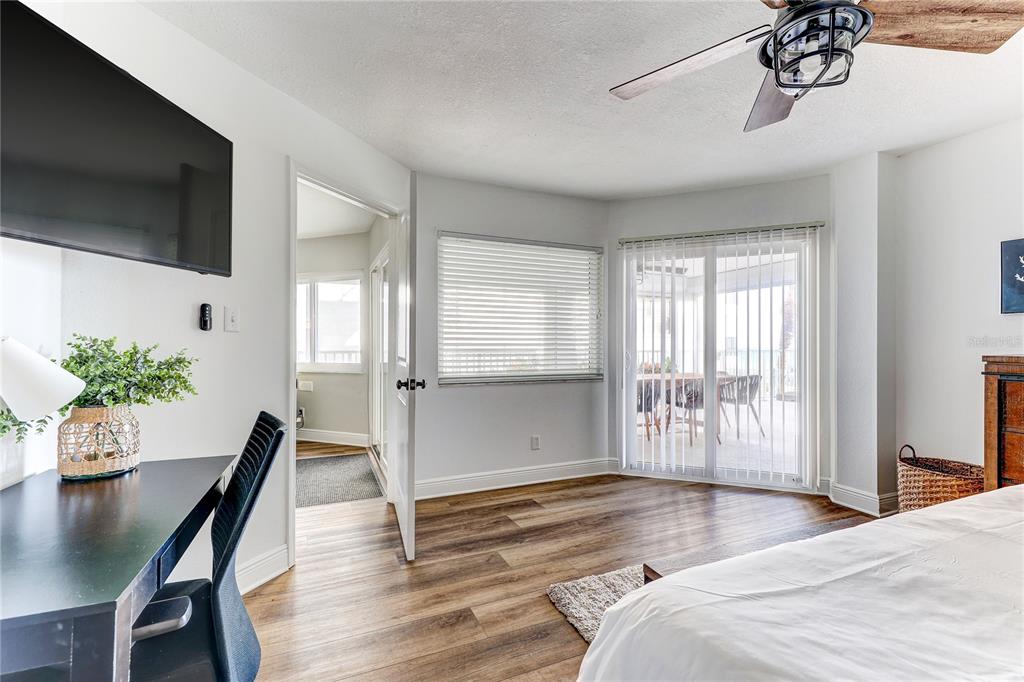 16332 Gulf Boulevard, Unit 1C Redington Beach, FL 33708 - Photo 62 of 90 a bedroom with furniture and a window
